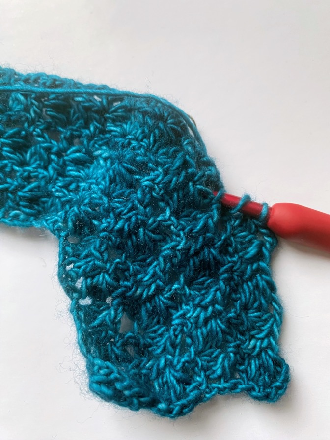 Weird blue-haired woman with a&nbsp;hook